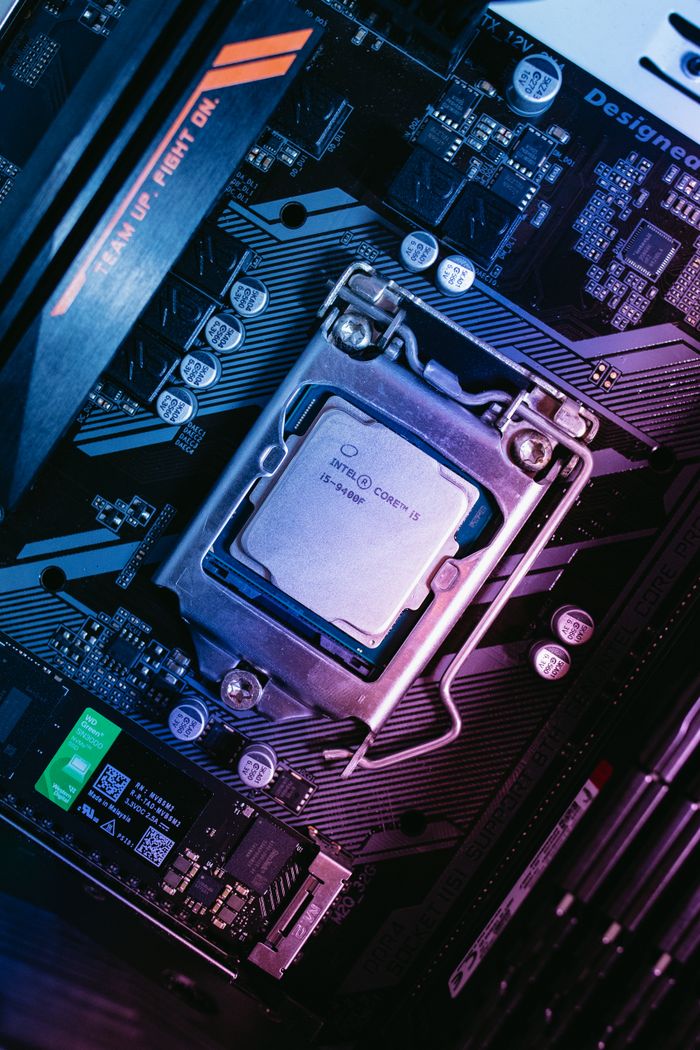 Services Detailed view of a computer motherboard with installed CPU, showcasing high-tech components.